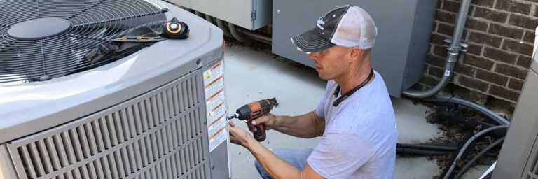 service technician working on air conditioner
