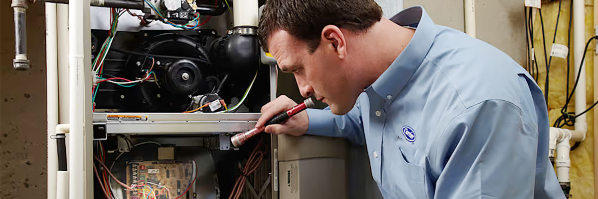 tech-performs-furnace-blower-motor-repair