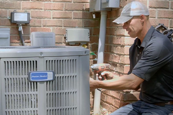 technician working on air conditioner