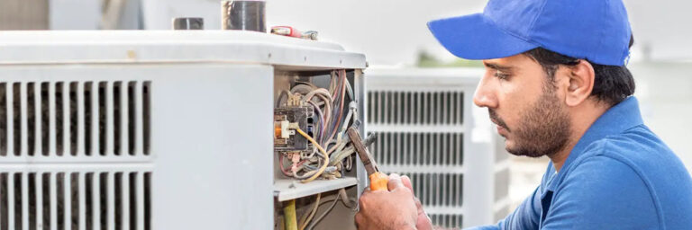 technician fixing AC